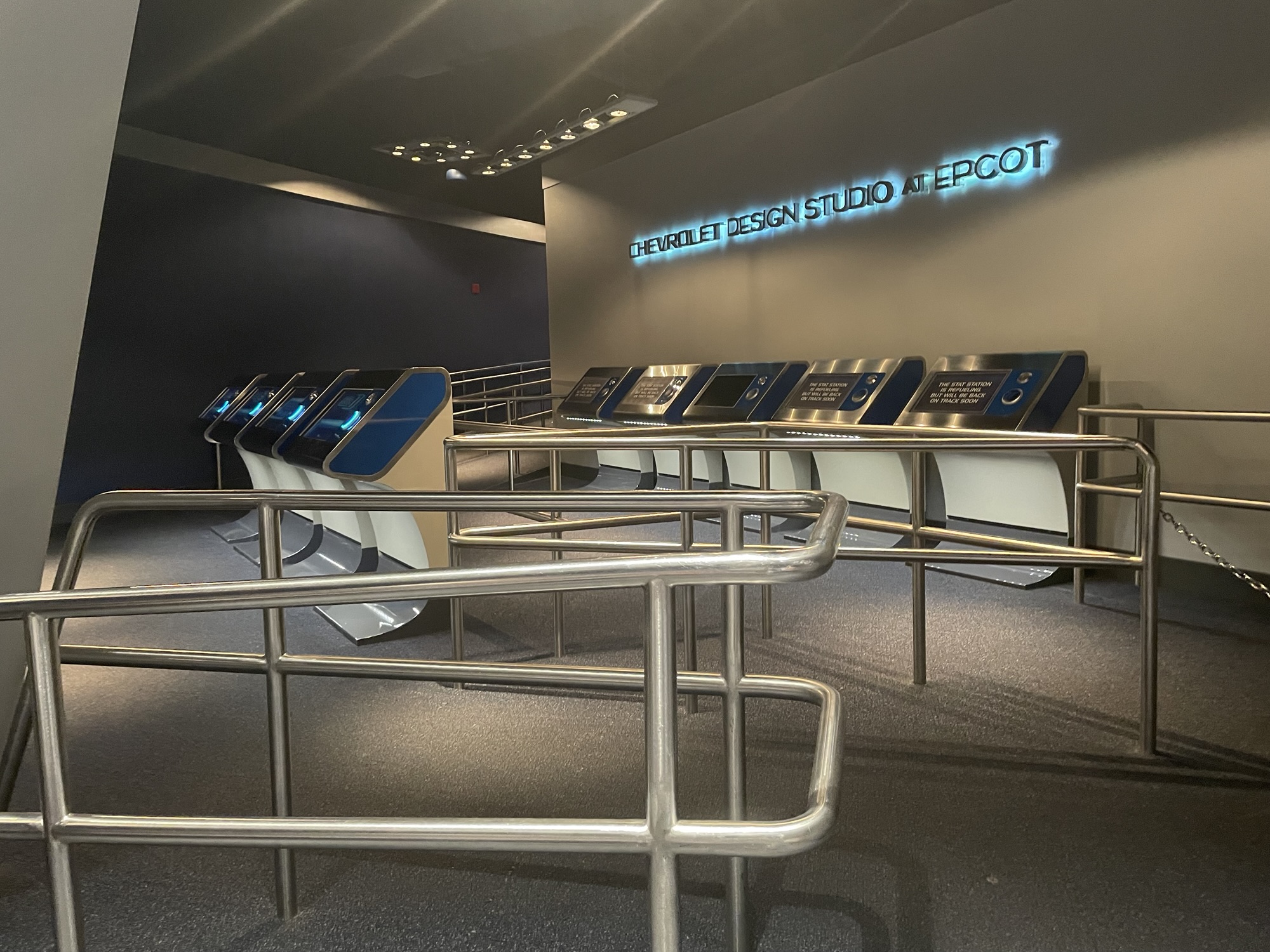 The empty spaces in the Test Track Queue. Railing. Vacant Computer Stations.